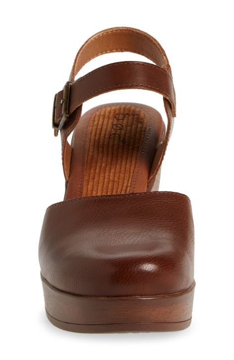 A woodgrain platform heel on a clog-inspired pump brings retro style to your ensembles. 3" heel Round toe Adjustable slingback strap with buckle closure Cushioned footbed Synthetic upper and lining, rubber sole Imported Brown Leather Clogs With 4-inch Heel, Brown Platform Slingback Pumps, Brown Platform Slingback Heels, Brown Platform Slingback Pumps With Ankle Strap, Brown Wedge Heel Clogs With Heel Strap, Brown Wedge Heel Clogs With Buckle Closure, Brown Slingback Pumps With Ankle Strap And Platform, Brown Platform Slingback Mules, Brown Slingback Platform Mules