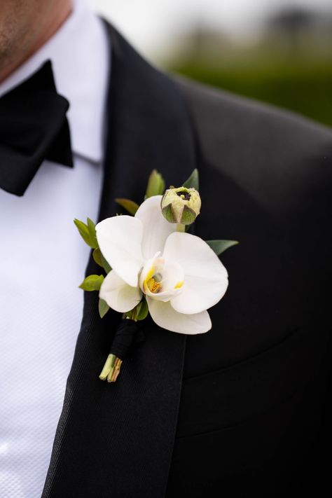 Orchid Boutonniere for Devon. Flowers: @rosehipsocial Orchid Winter Wedding Bouquet, All Orchid Bouquet, Small White Orchid Bouquet, Orchid And Greenery Bouquet, Orchids Flower Bouquet, Orchid Groom Boutonniere, Black Orchid Bouquet, Orchid Aisle Decor, Wedding Flowers With Orchids