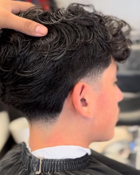 We suggest a low taper fade, a super simple yet impactful hairstyle if you have some edges that need trimming, or want to incorporate a fun, neat twist to your look. Click the article link for more photos and inspiration like this // Photo Credit: Instagram @eleganzebeautysalon // #longhairlowtaperfade #lowtaperfade #lowtaperfadehaircut #menshair #menshaircuts #shortlowtaperfade Low Taper Haircut, Low Fade Curly Hair, Taper Fade Long Hair, Taper Fade Short Hair, Fade Haircut Curly Hair, Low Taper Fade Haircut, Taper Fade Curly Hair, Low Taper Fade, Low Taper