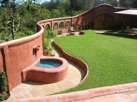 This is such a cool idea! Adding a "fence" around your home with windows. Love the fountain too, and the gate Plaster Projects, Rain Water Collection Diy, Earthbag House, Cob Home, Earth Ship, Cob Homes, Cob Building, Greenhouse Design, Earth Bag Homes