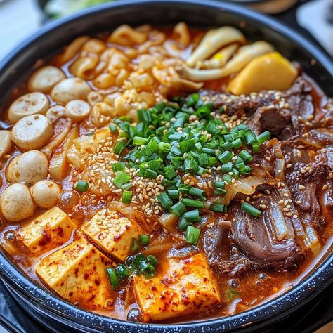 🥘🔥 Experience authentic Korean cuisine with Gopchang Jeongol—a rich and hearty hot pot filled with flavorful beef tripe! 🥩🌶️ #GopchangJeongol #KoreanHotPot Gopchang Jeongol (Beef Tripe Hot Pot) Ingredients: Beef tripe (300g, cleaned and cut into pieces) Mushrooms (100g, assorted, sliced) Korean radish (100g, sliced) Tofu (1 cup, cubed) Korean chili paste (Gochujang) (1 tbsp) Soy sauce (2 tbsp) Garlic (3 cloves, minced) Onion (1, sliced) Water (5 cups) Green onions (2, sliced) Sesame oil (1... Gopchang Recipe, Korean Hot Pot Recipe, Hot Pot Ingredients, Korean Hot Pot, Korean Beef Stew, Korean Radish, Korean Chili, Korean Chili Paste, Hot Pot Recipe