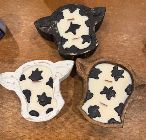 Mini cow head dough bowl candle, looks great on any table! these super cute dough bowls are perfect for any cow lover! Plus looks great and adds a touch of rustic charm. The candle is made with clean burning wicks and 100% soy wax, made in America. These are hand made to order in small batches, making each candle unique and one of a kind.  Made with clean fragrances that are phalate and paraben free and smell amazing!  They have 2 wood wicks for a cozy and clean burn. And even crackle for an even more relaxing atmosphere.  These are all hand made bowls and will have some slight differences from the pictures.  Approximately 8" by 7" wide by 2" high, and hold approximately 8oz of wax. Farmhouse Western, Candle Unique, Western Candles, Western Birthday Party, Country Candle, Mini Cows, Western Crafts, Wooden Dough Bowl, Dough Bowls