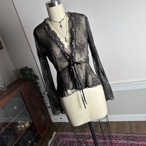 Vintage 90s 2000s sheer beaded lace ruffle extra long flare sleeve clasp bow tie front cardigan in like new condition. Size extra small but would fit someone small as well. Measurements: taken laying flat, chest 16.5”, waist 13”, hips 17.5”, sleeve 23”, length 19” and the fabric does have stretch #lacecardigan #fairy #cardigan #fairycore #2000s fairy core woodland y2k floral flower pattern grunge layering brown black fall inspo outfit jacket coat duster shirt cover up Lace Cardigan Outfit, Long Sheer Cardigan, Duster Shirt, Fairy Cardigan, Black Lace Cardigan, Lace Outer, Sheer Cardigan, 2025 Style, Cardigan Outfit