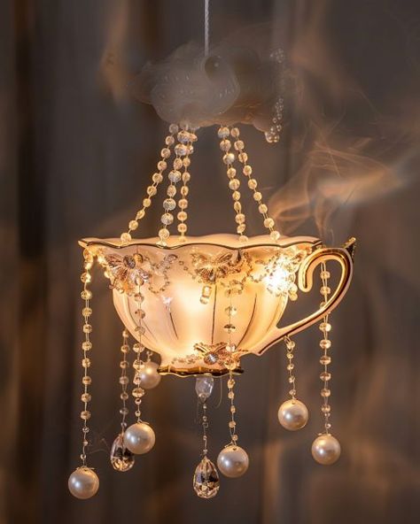 Fashion old teacups into delightful beauties with these 6 gorgeous ideas Teacup Light Fixtures, Tea Cup Projects, Teacup Candle, Unique Cake Stands, Tea Cup Jewelry, Fairy Teacup, Candles In Tea Cups Vintage Teacups, Tea Cup Bird Feeder, Tea Cup Cake