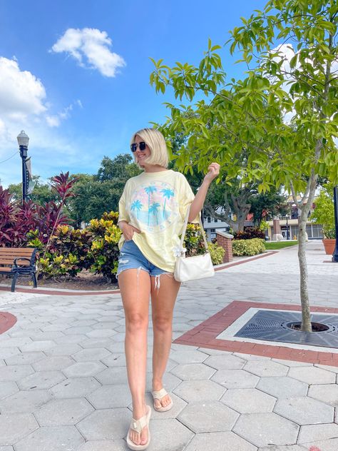 Oversized tee with denim shorts and flip flops. Follow @simplymarynoelle for more