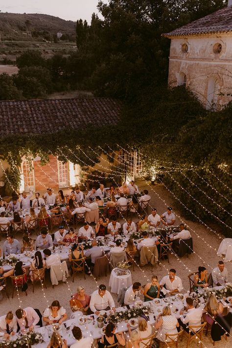 Wedding guests sit at banquet tables during outdoor wedding reception with fairy light canopy hanging above Light Canopy Wedding, Fairy Light Canopy, Canopy Wedding, Back Garden Wedding, Wedding Fairy, Lighting Wedding, Wedding In France, Provence Wedding, Garden Wedding Reception