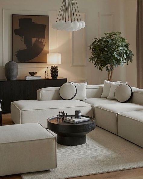 Beige Interior With Black Details, Beige Couch With Black Coffee Table, Black Beige Home Decor, Brown Black And White Living Room Minimalist, Black Furniture Design, White Sofa Black Coffee Table, Black White Beige Home Decor, Beige Sofa Black Coffee Table, Cream Sofa Black Coffee Table