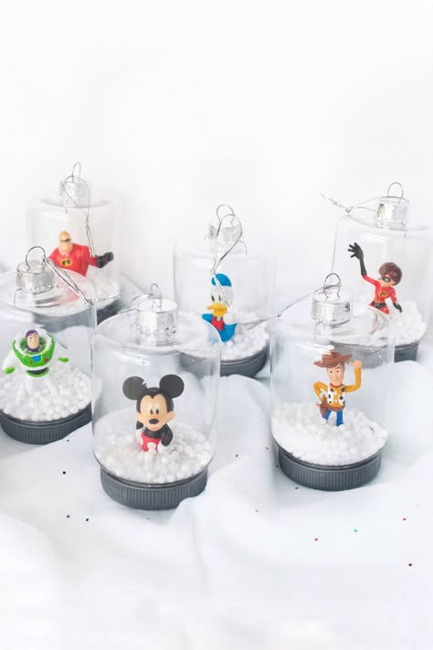 DIY Dollar Tree Disney Ornaments Dollar Store Crafts To Sell, Dollar Tree Disney, Disney Tree Topper, Dollar Tree Christmas Crafts Diy, Disney Ornaments Diy, Disney Christmas Crafts, Dollar Tree Christmas Crafts, Mickey Mouse Ornaments, Make Christmas Decorations