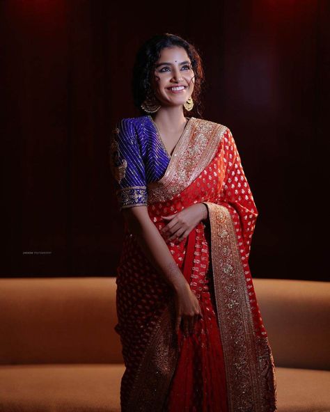 anupama parameswaran in a red saree by geethika kanumili for an event Red Blouse Outfit, Red Saree Blouse, Long Blouse Designs, Banaras Sarees, Blouse Designs Catalogue, Anupama Parameswaran, Latest Designer Sarees, Silk Saree Blouse Designs, Blouse Designs Silk