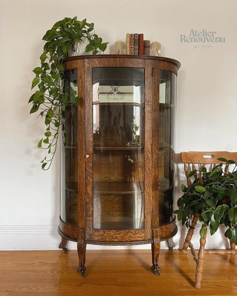 Restored antique curio cabinet made of quarter sawn oak #antique #antiquefurniturestyles #oak #oakfurniture #antiquehome Round Glass Hutch, Antique Glass Cabinet Display, Round China Cabinet, Curved Curio Cabinet, Curio Cabinet Aesthetic, Mid Century Curio Cabinet, Antique Armoire In Living Room, Mcm Curio Cabinet, China Cabinet Vintage