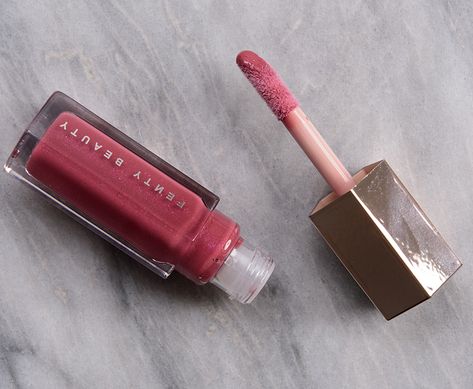 Fenty Beauty RiRi Gloss Bomb Lip Luminizer ($21.00 for 0.3 oz.) is a muted, medium-dark pink with subtle, warm undertones and fine, barely-there lavender and pink pearl throughout. Semi-sheer to semi-opaque, buildable coverage Lightweight, smooth, plush Applied evenly and softened the look of lip lines Long-wearing (4 hours), hydrating Fenty Lip Gloss Riri, Fenty Beauty Lip Gloss Riri, Pink Makeup Products, Fenty Beauty Lip Gloss, Perfect Pink Lipstick, Fenty Gloss, Glamour Makeup Looks, Fenty Beauty Gloss Bomb, Pink Gloss