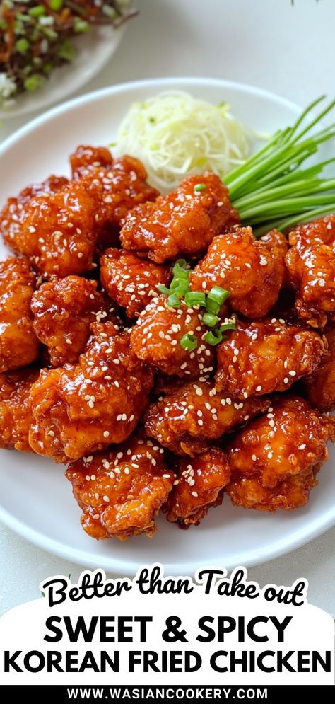 A plate of Korean fried chicken coated in a sticky, sweet, and spicy glaze, garnished with sesame seeds and green onions, served alongside fresh julienned cucumber for a flavorful and crispy dish. Crock Pot Sticky Chicken, Korean Barbecue Chicken, Korean Chicken Recipe, Korean Noodle Recipes, Healthy Korean Recipes, Spicy Asian Chicken, Korean Fried Chicken Recipe, Easy Korean Recipes, Asian Chicken Recipes