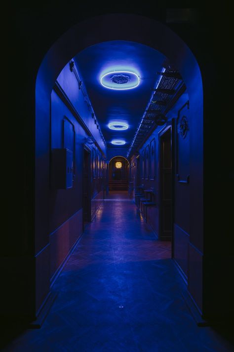 the existing 1930s building has been transformed into a mysterious and eclectic nightclub using contemporary shapes, colors and loud music. Ceramic Tile Colors, Oak Parquet Flooring, Touch Of Darkness, Nightclub Aesthetic, Nightclub Design, Vip Room, New Retro Wave, Blue Lights, Steel Frame Construction