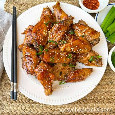 Baked Asian chicken wings are a delicious appetizer or snack that features chicken wings seasoned with Asian flavors and then baked in the oven. These wings typically involve a marinade made with ingredients commonly found in Asian cuisine, such as soy sauce, ginger, garlic, sesame oil, etc. They are a popular choice for those who enjoy the diverse and exciting flavors of Asian cuisine and the classic appeal of chicken wings. Believe me, once baked, they will disappear quickly!  Ingr… Asian Wings Recipe Oven Baked, Chicken Wings Asian Style, Sticky Asian Chicken Wings, Soy Garlic Ginger Chicken Wings, Soy Sauce Wings Oven Baked, Korean Soy Garlic Chicken Wings, Chicken Wing Seasoning, Garlic Ginger Chicken, Asian Chicken Wings