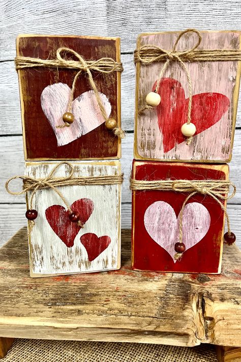 Elevate your rustic home decor game with our unique reclaimed wood primitive valentine blocks. Perfect as mantel decorations or tiered tray additions, these handcrafted masterpieces make for the ideal Valentine's Day gift. Click through to see how these beautiful blocks can transform your home! Wood Crafts For Valentines Day, Rustic Valentine Crafts, Valentine’s Day Crafts Wood, Primitive Valentine Decor Diy, Valentines Day Wood Crafts, Valentine Blocks, Wood Heart Crafts, Primitive Crafts Diy, Wooden Hearts Crafts