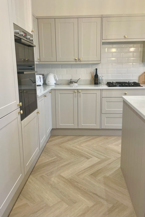 Happy couple standing in modern open plan kitchen 1930s House Renovation Kitchen, Terrace House Kitchen Ideas, Kitchen And Hallway Flooring, Kitchen Flooring Ideas Herringbone, Herringbone Floor Lounge, 1930 Home Decor 1930s Style, 1930s House Kitchen, Herringbone Kitchen Flooring, Heron Bone Flooring