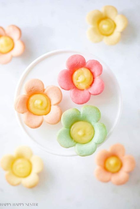 You've probably seen these Mini Lemon Flower Tarts all over social media. I jazz them up by adding colorful twists to my homemade cookie dough. Those springtime colors give these treats an extra pop! They're not just adorable—they're delicious, all thanks to that sweet, tangy lemon curd filling paired with the sugar cookie. Plus, they're super easy to make!