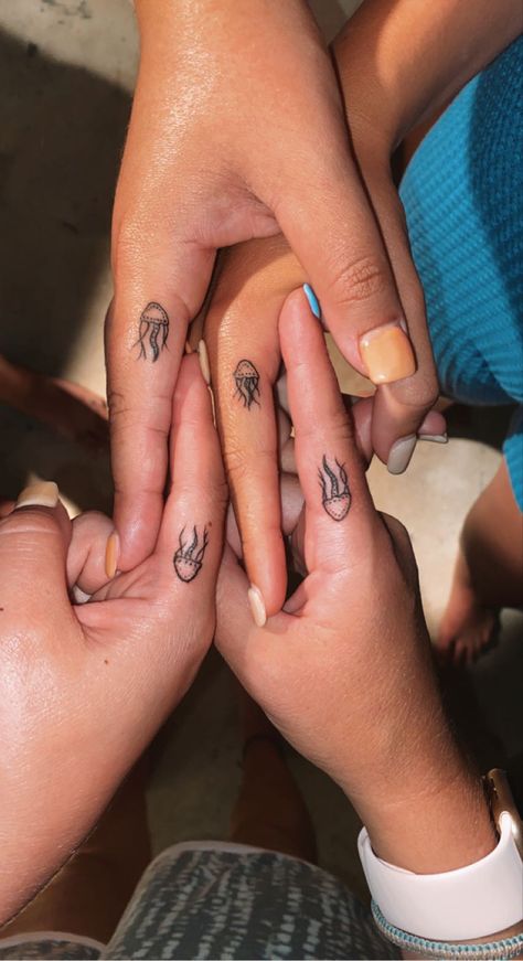 Tattoos For College Friends, Matching Tattoos Jellyfish, Jellyfish Finger Tattoo, Vacation Matching Tattoos, Matching Dainty Best Friend Tattoos, Ocean Finger Tattoos For Women, Matching Surf Tattoos, Finger Tattoos Ocean, Matching Sea Creature Tattoos