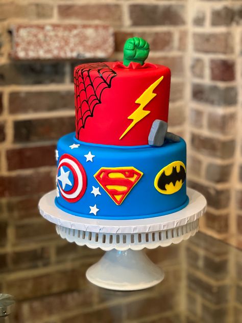 Marvel Vs Dc Birthday Cake, Cake Designs Superhero, Superhero First Birthday Cake, 2 Tier Superhero Cake, Super Heroes Cakes, Super Hero Birthday Cake Ideas, Superhero Themed Cake, Superhero Party Cake, Cake Ideas For 4 Year Boy