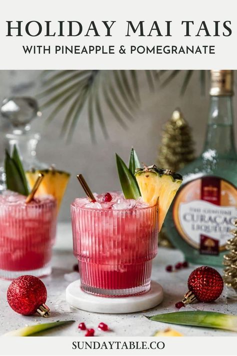 These holiday mai tais are perfect for Christmas and other winter holidays! This rum cocktail with pineapple juice, cranberry, lime, and Curacao liqueur is an easy, fun, creative, tropical drink for parties and the holidays. Use light, spiced, or dark rum depending on what you have. You can also make it in a pitcher for a crowd! Mai tais are a boozy, Hawaiian-inspired alcoholic drink but they're very drinkable and so good! If you need a Christmas drink for adults, your guests will love these. Summer Christmas Cocktails, Simple Cocktails, Christmas Cocktails Easy, Christmas Party Drinks, Pineapple Christmas, Pineapple Cocktail, Orange Cocktails, Cranberry Cocktail, Christmas Drink