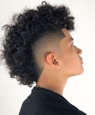 The Afro Hawk with a mid taper for black men is a dynamic hairstyle that combines the natural texture of an afro with the boldness of a mohawk. The Afro Hawk with a mid taper is not just a hairstyle; it's a statement, allowing black men to embrace their individuality with confidence and style. Afro Hawk, Frohawk Fade, Mid Taper, Skin Fade Hairstyle, Curly Mohawk Hairstyles, Short Sides Long Top, Man Haircuts, Top Hairstyles For Men, Male Haircuts Curly