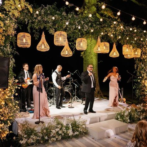 Kaytee Stice | Wedding Florist on Instagram: "There’s nothing quite like dancing under starlight. When the band starts the sounds of revelry begin! Planning + Design: @annaluciaevents Lighting: @jmeventgroup Dance Floor Wrap: @paradisegraphix Photo: @hunterryanphoto Entertainment: @aragonartists Floral Design: @rootsfloraldesign" Dance Floor Hanging Decor, Big Band Wedding, Wedding Dance Floor Decorations, Dance Floor Outside, Photo Stand Wedding, Wedding Dance Floor Design, Tent Dance Floor, Starlight Wedding, Dance Floor Wrap