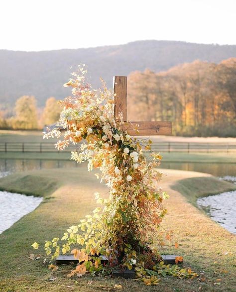 Cross decorated with fall leaves and flowers for a fall wedding; The Michael Wedding Barn event venue Pretty Chapel, Church Easter Ideas, Flowers On Cross, Wedding Inspo Flowers, Cross Decorations, Cross Flowers, Cross Background, Rose Ideas, St Ambrose