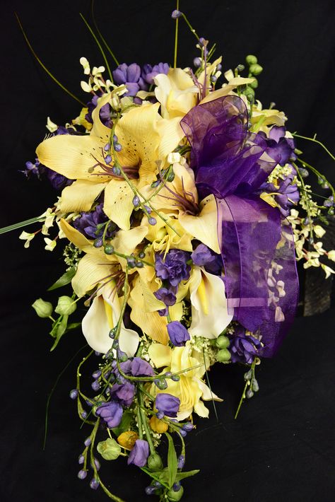 Brides Cascade Design Bouquet in Yellows and Purples by Island Bridal Bouquets by Elizabeth Rapunzel Wedding Theme, Cascade Wedding Bouquet, Purple Bridesmaid Bouquets, Rapunzel Wedding, Yellow Lilies, Tangled Wedding, Yellow Wedding Bouquet, Tangled Birthday, Cascading Wedding Bouquets