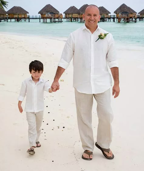 Beach Wedding Attire For Groom | Wedding Tropics Groom Outfit Beach Wedding Linen Shirts, Groomsmen Attire Beach Wedding Shorts, Simple Beach Wedding Ideas Groom Attire, Boys Beach Wedding Outfit, Linen Groomsmen Attire Beach, Beach Wedding Couple Outfit, Tropical Groomsmen Attire, Beach Wedding Men’s Outfit, Beach Wedding Groom Attire Linen