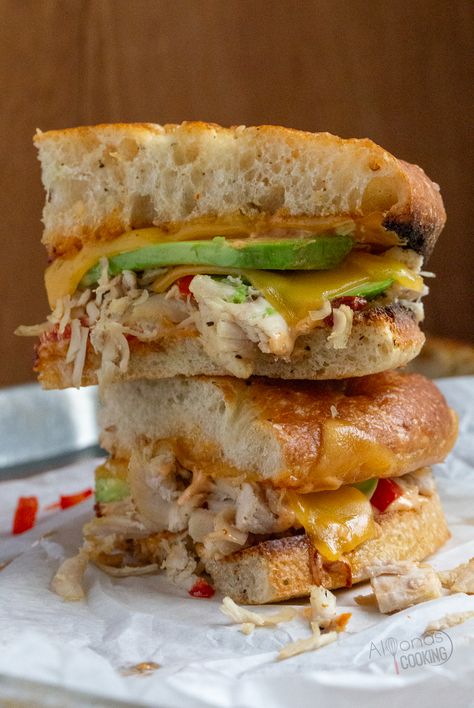 A chipotle chicken panini is a toasted sandwich made with Foccacia bread, avocado, cheese, cherry peppers, and chipotle sauce! It is the chipotle chicken panini, Panera Bread makes and I'm sharing all the tips for making this panini sandwich at home! #chicken #sandwich #Bread #Recipe Panera Chipotle Chicken Avocado Melt, Chicken Avocado Panini, Chipotle Chicken Panini, Chipotle Sandwich, Panera Sandwiches, Chicken Avocado Melt, Chicken Panini Sandwiches, Cherry Peppers, Toasted Sandwich