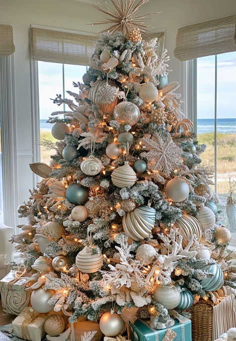 Coastal Christmas Tree Decor Ideas Coastal Flocked Christmas Tree, Blue Beach Christmas Decor, Beach Christmas Trees Decorations, Coastal Themed Christmas Tree, Costal Christmas Trees, Christmas Tree Ideas Light Blue, Beach House Christmas Tree, Coastal Christmas Tree Decorations, Beach Christmas Tree Ideas