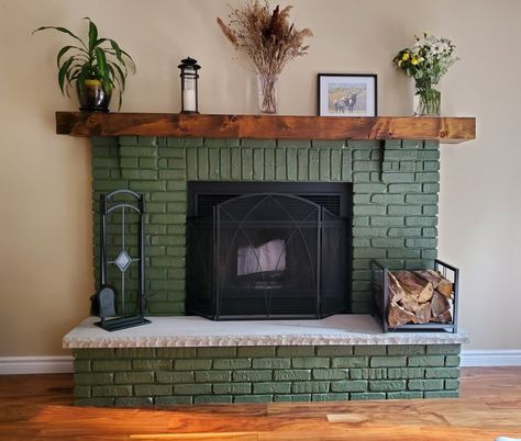 Colored Fireplace Painted Brick, Dark Green Painted Fireplace, Redoing Fireplace Ideas Brick, Unique Brick Fireplace, Dark Green Fireplace Tile, Painted Fireplace Green, Painted Green Brick Fireplace, Fireplace Facade Makeover, Unusual Fireplace Ideas