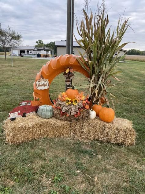 26 Stunning Fall Yard Decorations Fall Tire Decor, Painted Tires Ideas, Fall Farmers Market Display, Thanksgiving Hay Bale Decorations, Fall Haybale Decorating Ideas, Fall Tractor Decor, Fall Harvest Decorations Outdoor, Fall Hay Bale Decor Yard, Fall Decor Outside Yard