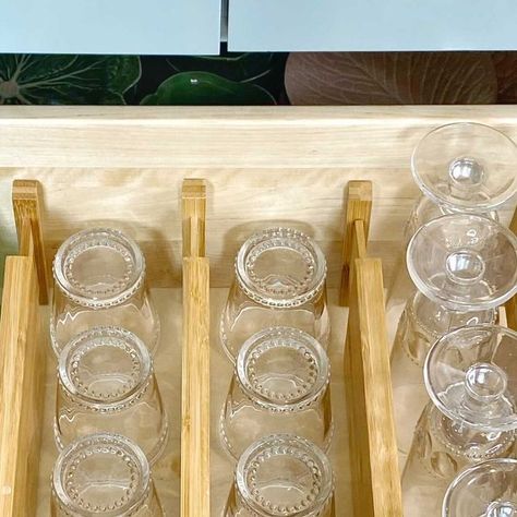 Amy Studebaker on Instagram: "How do you store your glassware?!?? This is one of my FAVORITE organizational hacks for storing and having easy access to glassware!! Any one of you can do this in your Kitchen! Nothing custom needed! My drawer is 30” wide and I store 42 glasses (each and every glass is easily accessible)! I’m not standing on tip toes looking through upper cabinets, I’m not digging behind particular styles of glassware to get to the “other” needed styles! I use bamboo spring loaded dividers and line the glasses up! They glasses don’t move or bump against each other at all! We have been using this method for two years and it has been a HUGE space saver as well as just easy access on a daily basis! @thecontainerstore . . . . . . #amystudebakerdesign #traditionaldesign #homedesi Storing Glasses In Drawers, Glass Storage In Drawers, Drawers For Glassware, Storing Glassware, Glasses Drawer Organizer, Drinking Glasses In Drawers, Glassware Drawer, Drawer Storage For Glassware, Glass Tubberware Organization