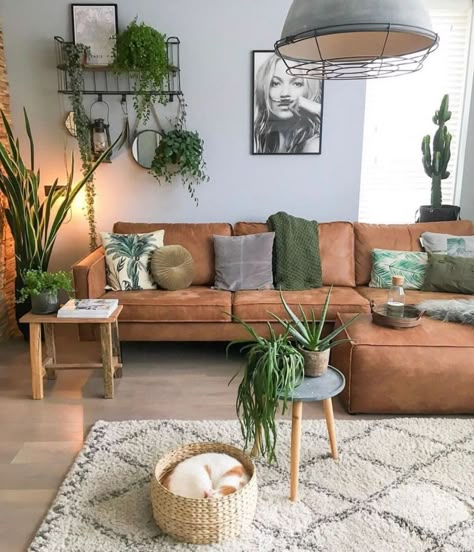 Rustic Plant Living Room, Brown Sofa Boho Living Room, Green Yellow Brown Living Room, Wood And Green Living Room, Green And Brown Living Room Color Scheme, Tan And Green Living Room, Brown Leather Sofa Living Room Decor, Green Living Room Decorating Ideas, Green And Wood Living Room