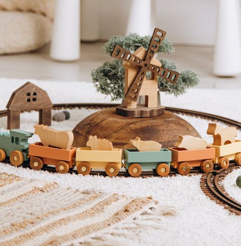 • Personalized Colored Freight Train With Animals • Introducing our classic wooden train, made of solid wood and built to last for generation. This timeless toy is perfect for children of all ages and is sure to become a beloved keepsake in any family. It’s a great way to introduce kids to the joys of traditional toys and provide hours of fun and entertainment. Give the gift of imagination with our wooden train - a gift that will be treasured for Vintage Wood Toys, Boy Toys Toddler, Two Year Old Gift Ideas, Gifts For 1 Year Baby Boy, Toddler Boy Christmas Gifts, Baby Toys Aesthetic, Wood Train Toy, Simple Wooden Toys, Woodland Playroom