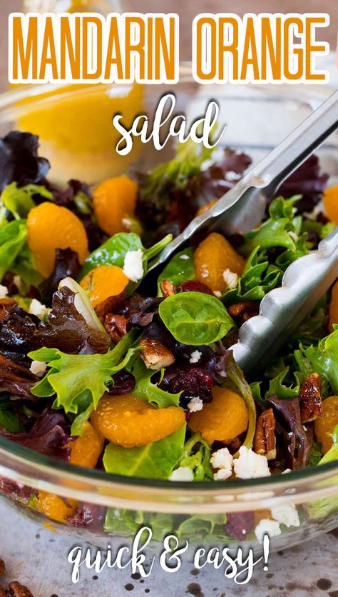 This mandarin orange salad is mixed greens with juicy orange slices, dried cranberries, feta cheese and candied pecans, all tossed in a homemade dressing. Spring Mix Salad Recipes, Mandarine Recipes, Candied Pecans For Salad, Mandarin Salad, Orange Salad Recipes, Mandarin Orange Salad, Christmas Salad Recipes, Spring Mix Salad, Winter Salad Recipes