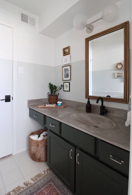 I redid our bathroom with a few purchased pieces and a whole bunch of diy. You can make the best of a space by working with what you've got! | House Homemade Concrete Countertops Bathroom, Master Bath Renovation, New Paint Colors, Concrete Bathroom, Concrete Counter, Bamboo Mirror, Plant House, Bath Renovation, Green Cabinets