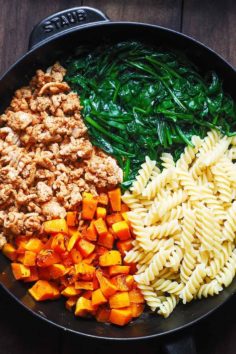 Ingredients for pasta in a cast-iron skillet: cooked ground turkey, cooked spinach, cooked pasta, roasted butternut squash Butternut Squash And Spinach Pasta, Turkey Squash Skillet, Butternut Squash And Turkey Recipes, Ground Turkey Protein Pasta, Ground Chicken And Butternut Squash, Turkey And Squash Recipes, Butternut Squash With Ground Turkey, Butternut Squash Turkey Recipes, Ground Turkey Squash Recipes