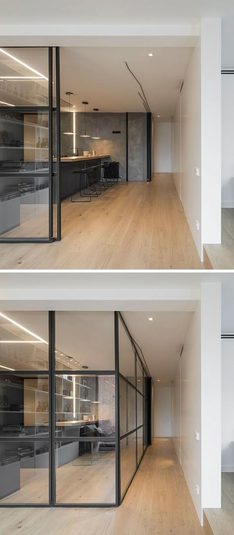 Black framed glass walls can be used to close off this modern kitchen from the other spaces of the penthouse when needed. Interior Design Minimalist, Kitchen Floor Plans, Kitchen Designs Layout, The Penthouse, Glass Walls, 아파트 인테리어, Wooden Floors, Inside And Outside, Open Kitchen