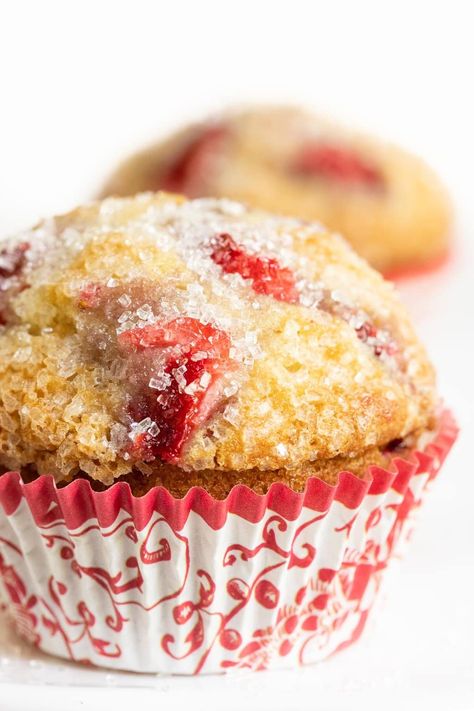 With a crunchy, raw sugar topping, a moist tender crumb and bits of delicious strawberries in every bite, these high-domed Fresh Strawberry Buttermilk Muffins are a no-fail hit, every time! #strawberrymuffins, #easymuffins, #buttermilkmuffins