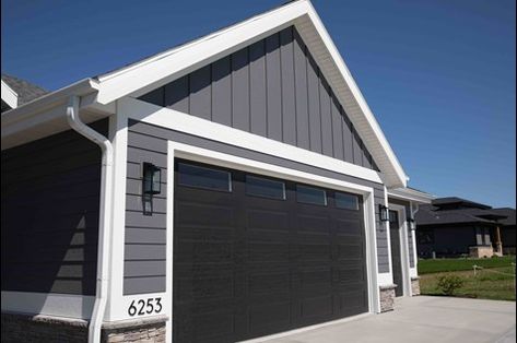 Garage Door Trim Ideas, Barn Shop Ideas, Door Trim Ideas, House Siding Options, Grey Garage Doors, Dark Grey Houses, Exterior Garage Door, Garage Door Trim, Black Garage Doors