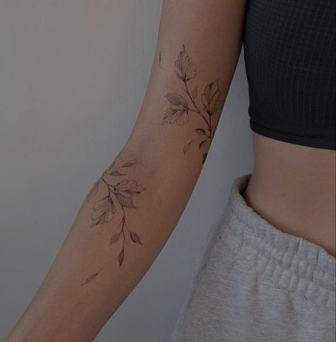 Tattoos Wrist Wrap Around, Around The Arm Flower Tattoo, Floral Shoulder Cap Tattoo Fine Line, Floral Leaf Wrap Tattoo, Marigold Wrap Around Tattoo, Dainty Vine Tattoo Arm, Floral Biblical Tattoo, Wrap Tattoo Shoulder, Flowery Vine Tattoo