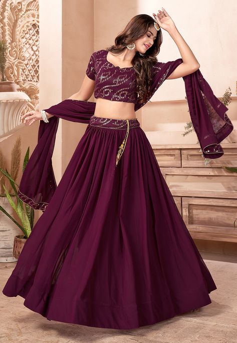 Unstitched Faux Georgette Lehenga in Wine This attire with Faux Crepe Lining is Enhanced with Resham, Zari, Sequins and Patch Border Work Available with a Unstitched Faux Georgette Choli in Wine and a Faux Georgette Dupatta in Wine The Semi-Stitched Lehenga Waist and Hips are Customizable from 28 to 36 inches and from 36 to 46 inches respectively and Lehenga Length is 40 inches Do Note: Accessories shown in the image are for presentation purposes only. (Slight variation in actual color vs. imag Purple Colour Lehenga, Lehenga Designs Bridesmaid, Light Purple Lehenga, Purple Bridal Lehenga, Reception Lehenga Bridal, Lehenga Type, Trendy Lehenga, Wedding Wear Indian, Sequins Lehenga