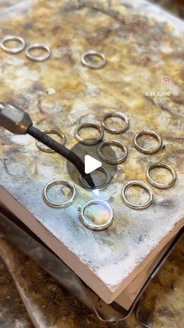 Jen Surine on Instagram: "I love fusing jump rings, especially when I’m using Argentium silver.  Argentum loves to fuse… sometimes it fuses when you don’t want it to fuse it loves to fuse that much. 

But what is fusing? Fusing is joining two metals together only using heat, it actually begins to melt at that specific join and the two ends become one piece. 

There are a lot of reasons to fuse something rather than solder it. Either aesthetically, for a seamless result, or to keep the integrity of the metal all the same. It’s also quicker not dealing with little balls of solder rolling around in the wrong places. 

Have you ever fused metal? It is kinda magical, right?

#jewelrytips #makingjewelry #metalsmith #satisfying" Argentium Silver, Soldering, Jump Rings, Have You Ever, Two By Two, Jewelry Making, Heat, Bra, Silver