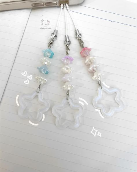 —star lily collection .☘︎ ݁˖ handmade & inspired by the lily of the valley available in 2 designs ↴ [small] lily of the valley phone charm - dark blue - blue - purple - pink [large] lily of the valley phone charm - blue - purple - pink available soon on our website! ꒰ᐢ. .ᐢ꒱₊˚⊹ #keychains #keychaincollection #smallbusiness #lilyofthevalley #cutekeychain #kpopbusiness #kpopshop #smallshop #cuteflowers #keychaindesign Star Lily, E Flowers, Kpop Shop, Keychain Design, Cute Keychain, Phone Charm, Lily Of The Valley, Small Designs, Small Shop