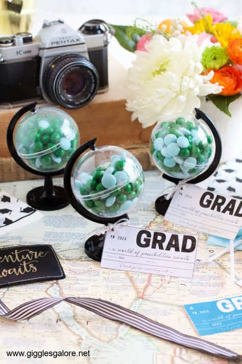 Adventure Awaits Globe Favors Adventure Party Favors, Travel Graduation Party Ideas, Adventure Theme Graduation, Let The Adventure Begin Graduation Party, Adventure Awaits Graduation Party, The Adventure Begins Graduation Party, Party Photo Backdrop, Graduation Tables, Graduation Party Centerpieces