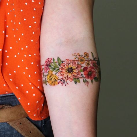 60+ Flower Tattoo Ideas That Will Leave You Feeling Inspired - 100 Tattoos Floral Arm Tattoo, Wrist Band Tattoo, Cuff Tattoo, Flower Tattoo Ideas, Bright Tattoos, Wrap Tattoo, Flower Wrist Tattoos, Anklet Tattoos, Floral Tattoo Sleeve