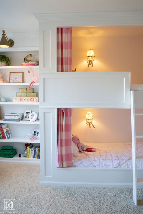 AMAZING DIY built-in bunk beds gorgeous with curtains, elegant design, and lighting make this the ultimate shared girls bunk room! This detailed tutorial shares everything you need to build your own--perfect for a cabin, a beach house, or shared siblings bedroom at home. Curtains Around Bunk Bed, Built In Bunk Beds With Curtains, Sisters Bedroom Ideas Shared Rooms Bunkbed, Custom Made Bunk Beds, Elegant Bunk Beds, Built In Bed With Curtains, Custom Built Bunk Beds, How To Build Bunk Beds, Built In Bunks Small Room