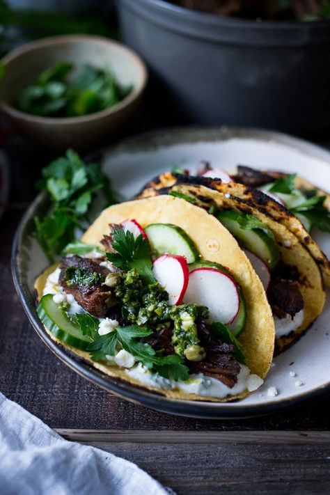 Greek Lamb Tacos with Tzatziki Sauce, cucumber and radishes. A Made with tender, falling off the bone, slow-roasted Lamb shoulder. Delicious flavors! #lamb #lambtacos #lambshoulder #slowroasted #braisedlamb www.feastingathome.com Greek Style Lamb, Lamb Tacos, Lamb Taco, Slow Roasted Lamb Shoulder, Mint Yogurt Sauce, Mexican Feast, Greek Lamb, Feasting At Home, Slow Roast Lamb